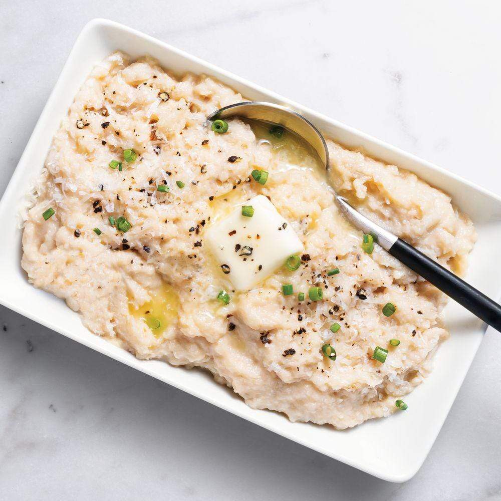 Mashed Parmesan Cauliflower with butter in rectangle plate